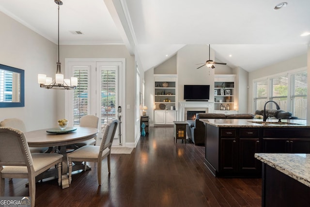 6430 Banbury Ct SE, Mableton, GA 30126 - dining area featuring ceiling fan, plenty of natural light, a chandelier, dark wood-style floors, and vaulted ceiling
