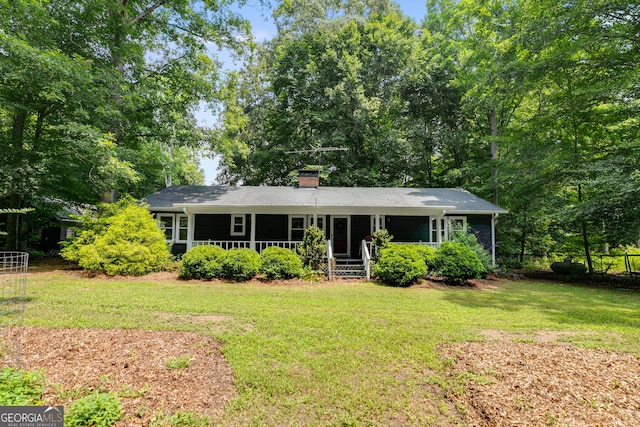 220 Gamble Dr, Carrollton, GA 30116 - single story home with a front lawn, a porch, and a chimney