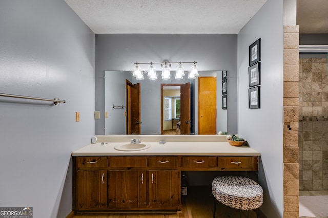 220 Gamble Dr, Carrollton, GA 30116 - bathroom featuring vanity and a tile shower