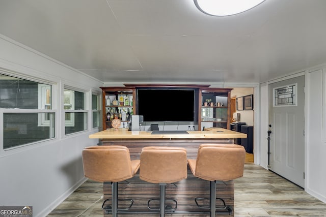 220 Gamble Dr, Carrollton, GA 30116 - bar area featuring wood finished floors and baseboards