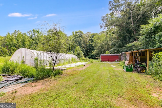 220 Gamble Dr, Carrollton, GA 30116 - view of grassy yard with an outdoor structure