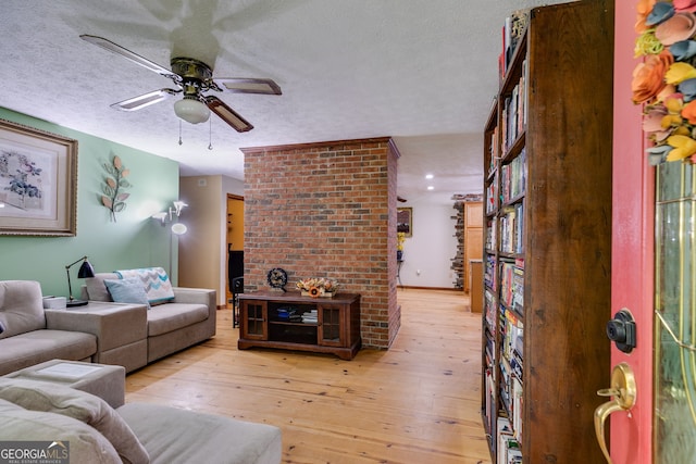 220 Gamble Dr, Carrollton, GA 30116 - living room featuring a ceiling fan, light wood finished floors, and a textured ceiling