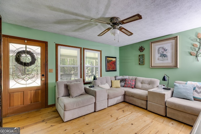 220 Gamble Dr, Carrollton, GA 30116 - living room featuring light wood-type flooring, a textured ceiling, and ceiling fan