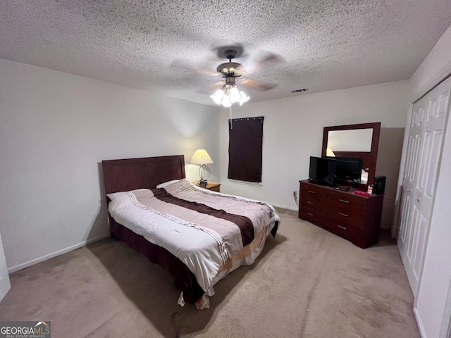 1106 Shiloh Ln NW, Kennesaw, GA 30144 - bedroom with light colored carpet, a closet, a ceiling fan, and a textured ceiling