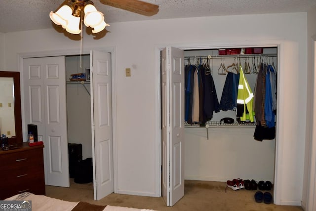 1106 Shiloh Ln NW, Kennesaw, GA 30144 - carpeted bedroom with two closets, ceiling fan, and a textured ceiling