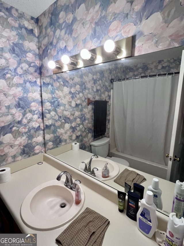 1106 Shiloh Ln NW, Kennesaw, GA 30144 - bathroom featuring wallpapered walls, shower / bathtub combination with curtain, vanity, and a textured ceiling