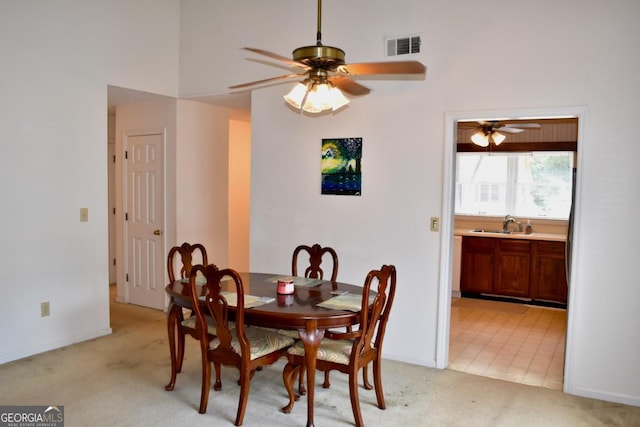 1106 Shiloh Ln NW, Kennesaw, GA 30144 - dining room with light carpet, ceiling fan, and a high ceiling