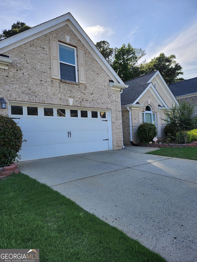 979 Simonton Dr, Lawrenceville, GA 30045 - view of front of property with a garage, driveway, and stone siding
