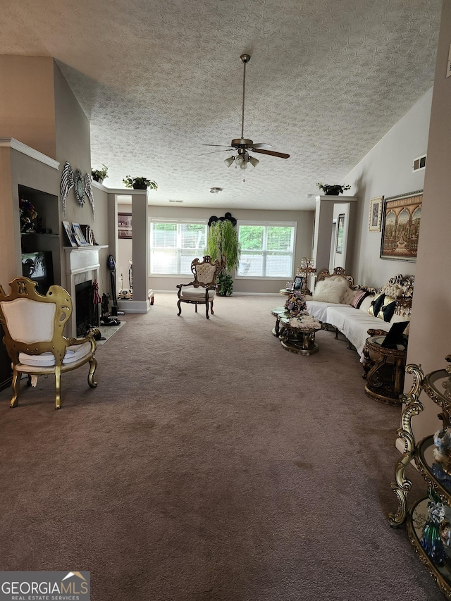979 Simonton Dr, Lawrenceville, GA 30045 - living area featuring a textured ceiling, ceiling fan, carpet flooring, a fireplace, and vaulted ceiling