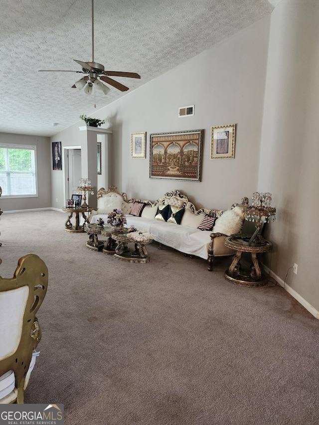 979 Simonton Dr, Lawrenceville, GA 30045 - living area with carpet flooring, a textured ceiling, vaulted ceiling, and ceiling fan