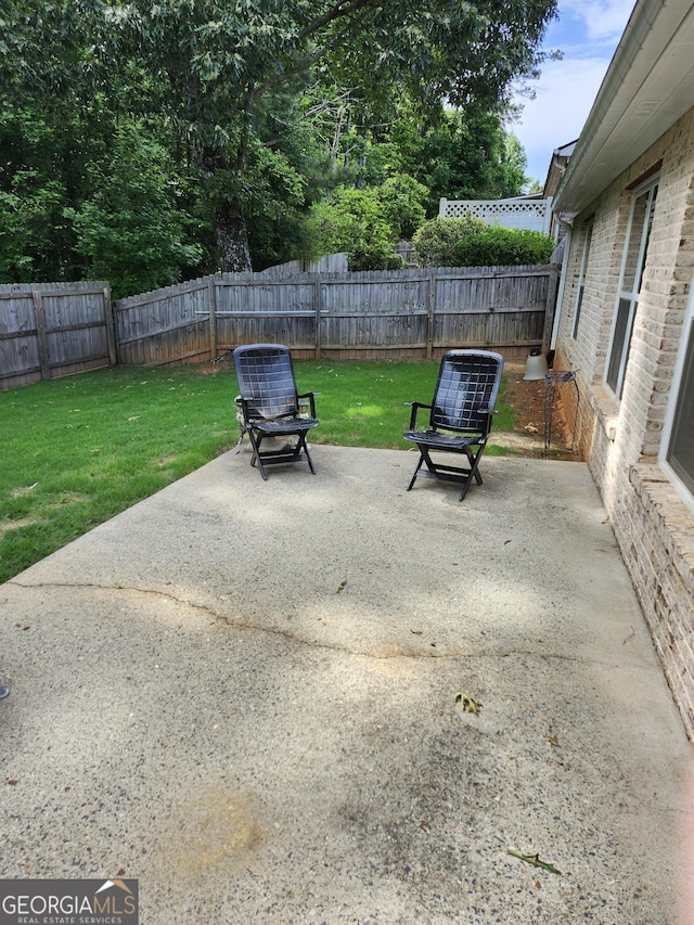 979 Simonton Dr, Lawrenceville, GA 30045 - fenced backyard with a patio