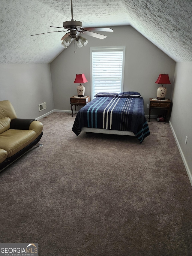 979 Simonton Dr, Lawrenceville, GA 30045 - bedroom featuring a textured ceiling, vaulted ceiling, carpet floors, and a ceiling fan