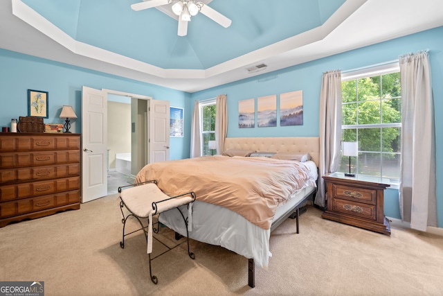 5340 Harris Creek Dr, Cumming, GA 30040 - carpeted bedroom with a tray ceiling, multiple windows, and a ceiling fan
