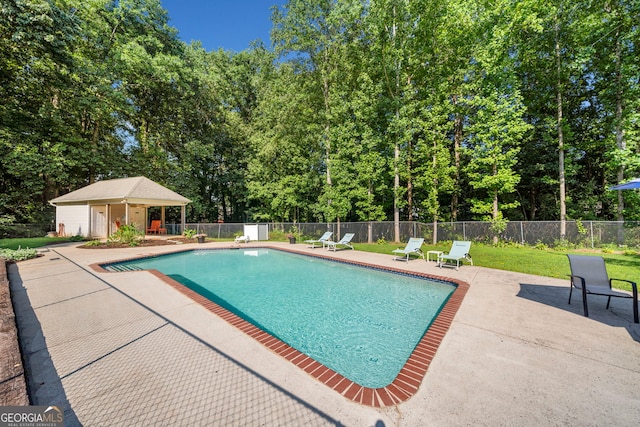 5340 Harris Creek Dr, Cumming, GA 30040 - view of pool with a patio area, view of scattered trees, and an outdoor structure