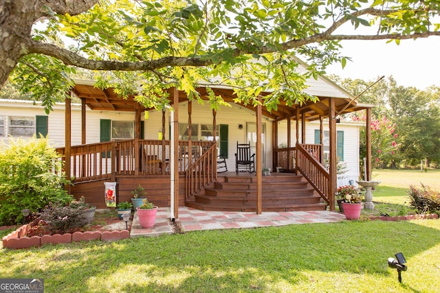3564 Chapel Cir, Blackshear, GA 31516 - view of front facade featuring a front lawn and covered porch