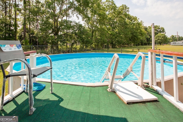 3564 Chapel Cir, Blackshear, GA 31516 - swimming pool featuring view of wooded area