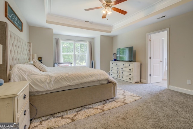 116 Sophie Cir, Locust Grove, GA 30248 - bedroom with a raised ceiling, light carpet, crown molding, connected bathroom, and a ceiling fan