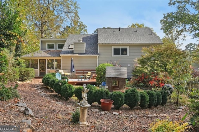 2653 Partridge Trl, Duluth, GA 30097 - rear view of property featuring a deck, a sunroom, and roof with shingles