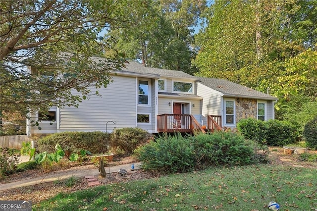 2653 Partridge Trl, Duluth, GA 30097 - tri-level home with a front lawn and stone siding