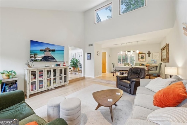 2653 Partridge Trl, Duluth, GA 30097 - living room featuring wood finished floors and a towering ceiling