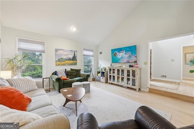 2653 Partridge Trl, Duluth, GA 30097 - living area featuring high vaulted ceiling and wood finished floors