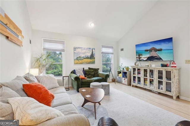 2653 Partridge Trl, Duluth, GA 30097 - living room featuring wood finished floors and high vaulted ceiling