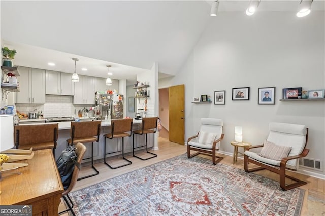 2653 Partridge Trl, Duluth, GA 30097 - living area with light wood-style flooring and high vaulted ceiling