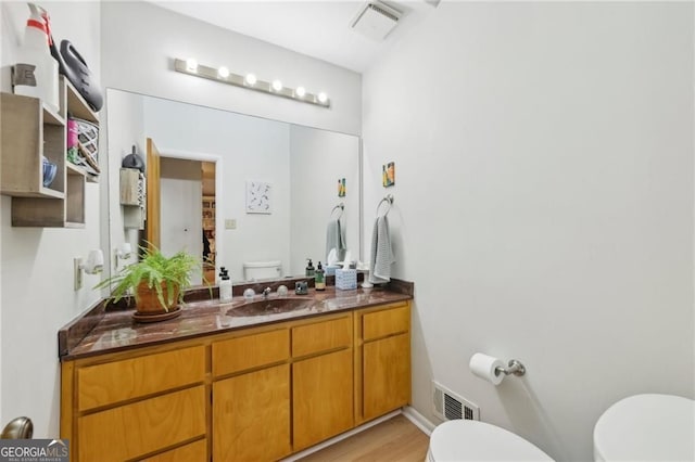 2653 Partridge Trl, Duluth, GA 30097 - half bathroom with vanity and wood finished floors