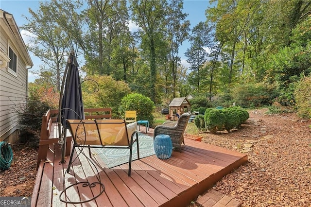2653 Partridge Trl, Duluth, GA 30097 - wooden terrace with a storage unit and an outdoor living space