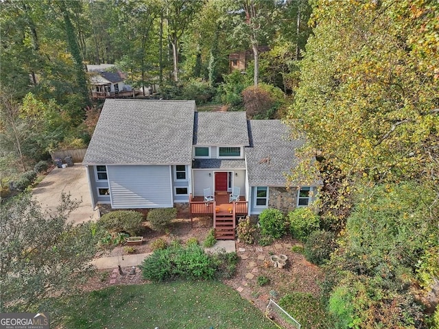 2653 Partridge Trl, Duluth, GA 30097 - view of front of home featuring roof with shingles and a wooden deck