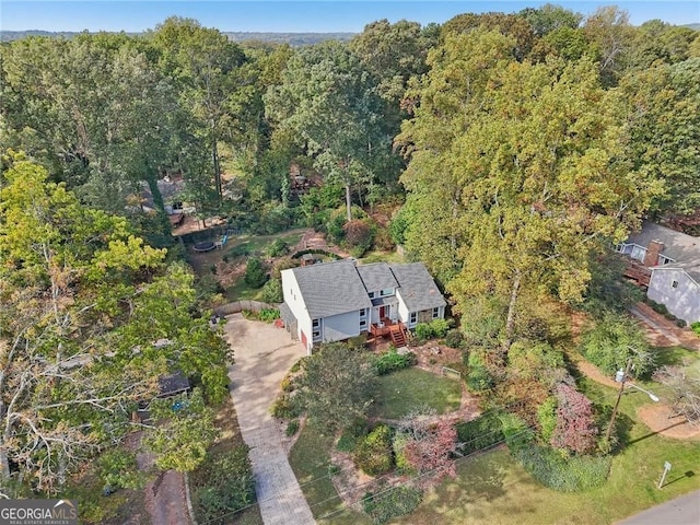 2653 Partridge Trl, Duluth, GA 30097 - aerial view of property and surrounding area featuring a heavily wooded area