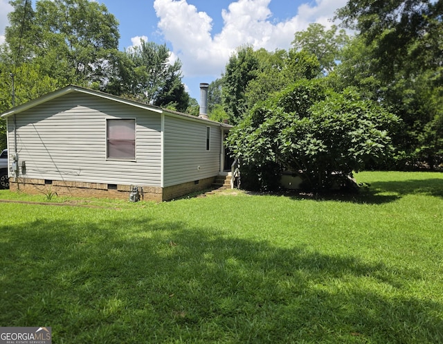 201 Rogers St, Mcdonough, GA 30253 - view of side of home featuring crawl space, a lawn, and entry steps