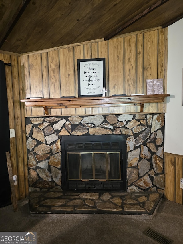 201 Rogers St, Mcdonough, GA 30253 - detailed view of a fireplace, wooden walls, carpet, and wood ceiling