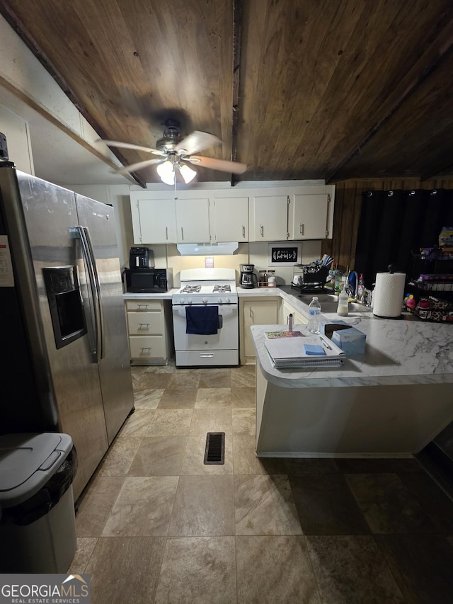 201 Rogers St, Mcdonough, GA 30253 - kitchen featuring white range with gas cooktop, wooden ceiling, stainless steel refrigerator with ice dispenser, under cabinet range hood, and black microwave