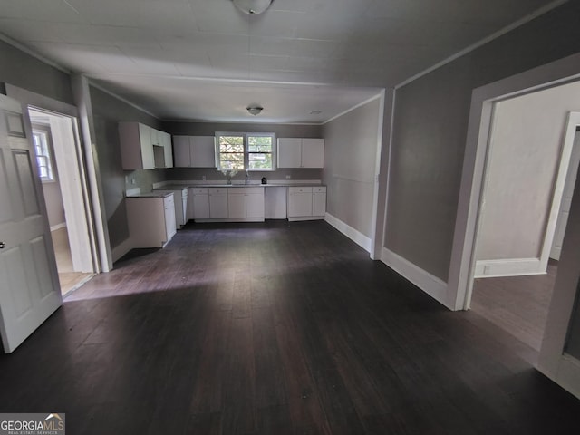 501 Calhoun Ave NE, Rome, GA 30161 - kitchen featuring white cabinets, dark wood-style floors, and ornamental molding