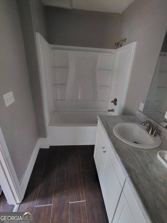 501 Calhoun Ave NE, Rome, GA 30161 - full bath with vanity, wood finished floors, and shower / bath combination
