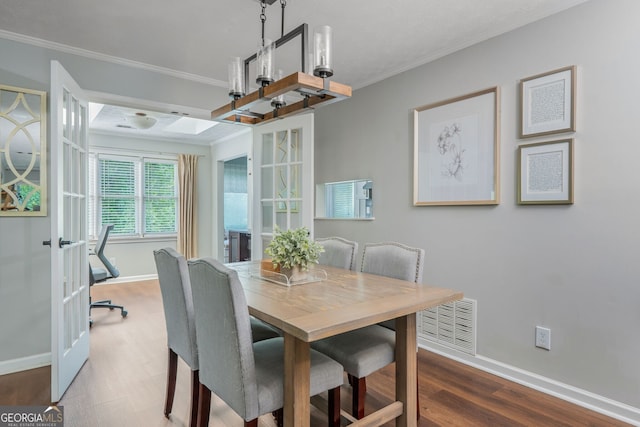 9 Saint Claire Ln NE, Atlanta, GA 30324 - dining area featuring crown molding and wood finished floors