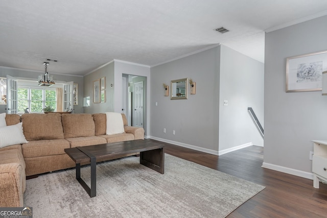 9 Saint Claire Ln NE, Atlanta, GA 30324 - living room featuring wood finished floors, ornamental molding, and a chandelier