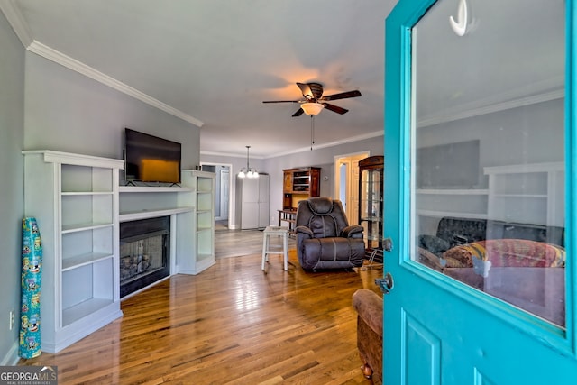 104 View St, Clarkesville, GA 30523 - living area featuring a fireplace, ceiling fan, wood finished floors, and crown molding