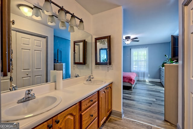 104 View St, Clarkesville, GA 30523 - bathroom with double vanity, wood finished floors, ensuite bathroom, and a ceiling fan