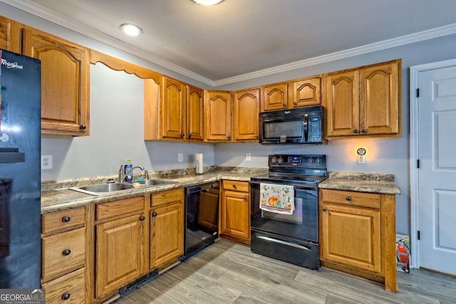 104 View St, Clarkesville, GA 30523 - kitchen featuring black appliances, crown molding, brown cabinets, and light wood-style flooring