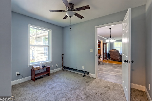 104 View St, Clarkesville, GA 30523 - unfurnished room featuring carpet flooring, a ceiling fan, and a chandelier