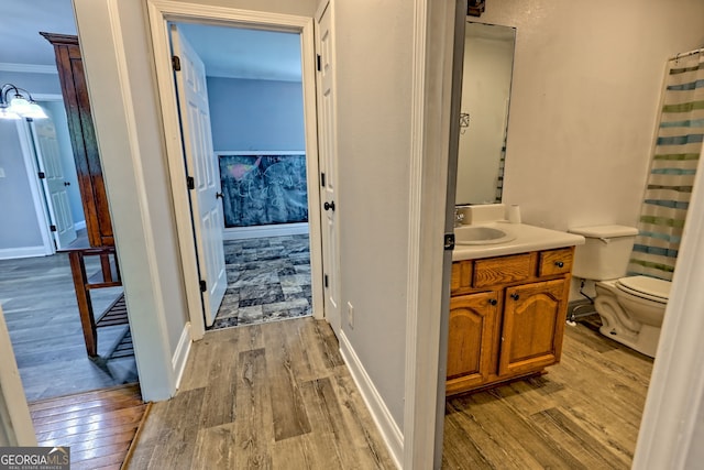 104 View St, Clarkesville, GA 30523 - full bath featuring vanity, wood finished floors, curtained shower, and crown molding