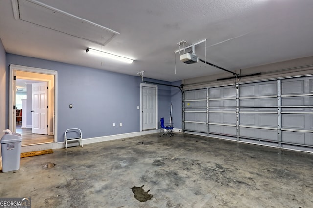 104 View St, Clarkesville, GA 30523 - garage with a garage door opener and baseboards