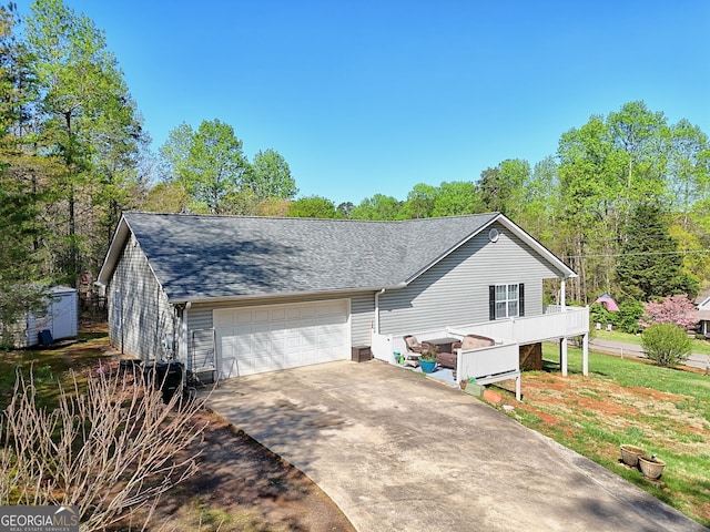 104 View St, Clarkesville, GA 30523 - view of front facade with roof with shingles, a storage unit, and driveway