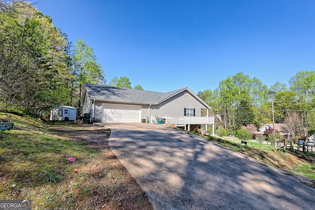 104 View St, Clarkesville, GA 30523 - view of front of property featuring concrete driveway, an attached garage, and a shed