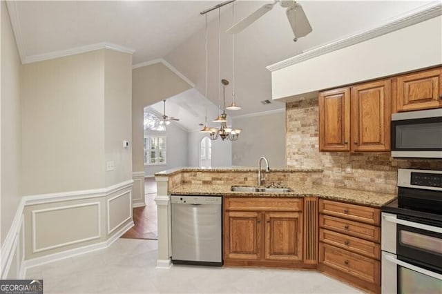 3707 Vineyards Lake Cir NW Unit 22, Kennesaw, GA 30144 - kitchen featuring appliances with stainless steel finishes, a ceiling fan, a peninsula, brown cabinets, and light stone counters