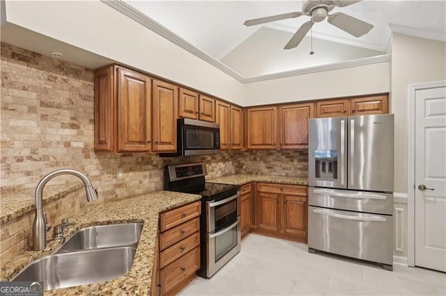 3707 Vineyards Lake Cir NW Unit 22, Kennesaw, GA 30144 - kitchen featuring stainless steel appliances, brown cabinetry, vaulted ceiling, decorative backsplash, and light stone counters