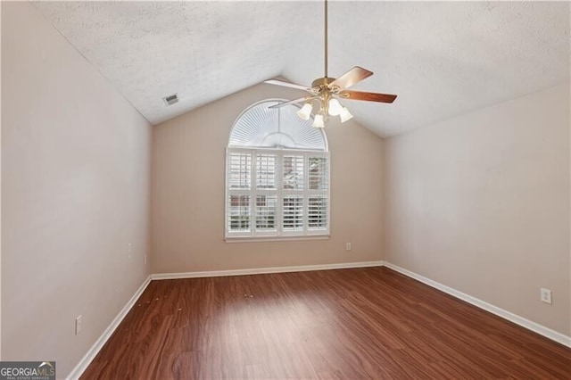 3707 Vineyards Lake Cir NW Unit 22, Kennesaw, GA 30144 - empty room featuring a ceiling fan, wood finished floors, a textured ceiling, and lofted ceiling
