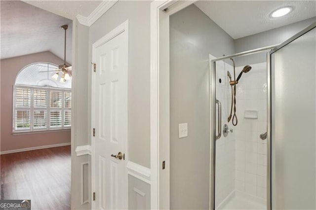 3707 Vineyards Lake Cir NW Unit 22, Kennesaw, GA 30144 - bathroom with a stall shower, wood finished floors, a ceiling fan, and lofted ceiling